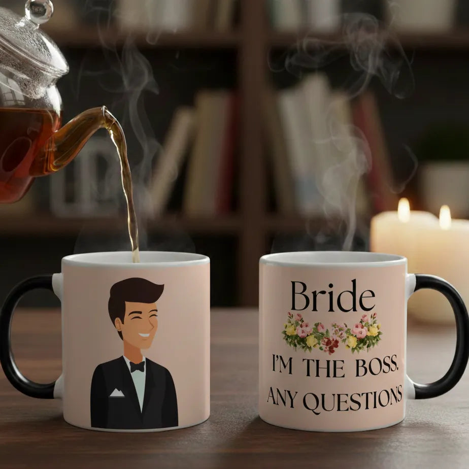 Tea being poured into a mug with a man's face and another mug with 'Bride I'm the boss any questions' text, against a blurred bookshelf background.