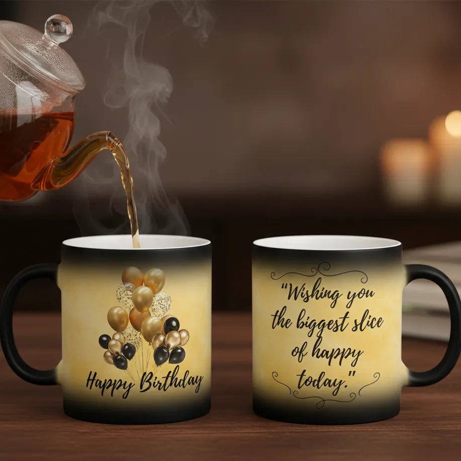 Two mugs with decorative text and graphics, one being filled with tea.