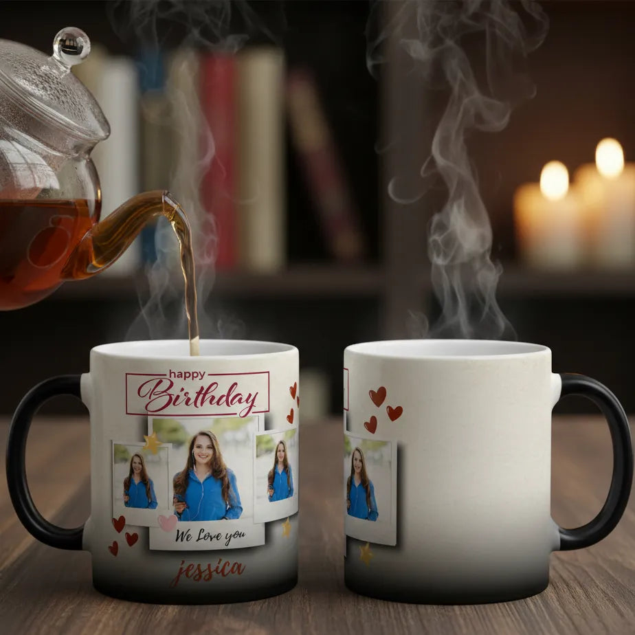 Two mugs with personalized designs, one being filled with steaming hot liquid, on a wooden surface.