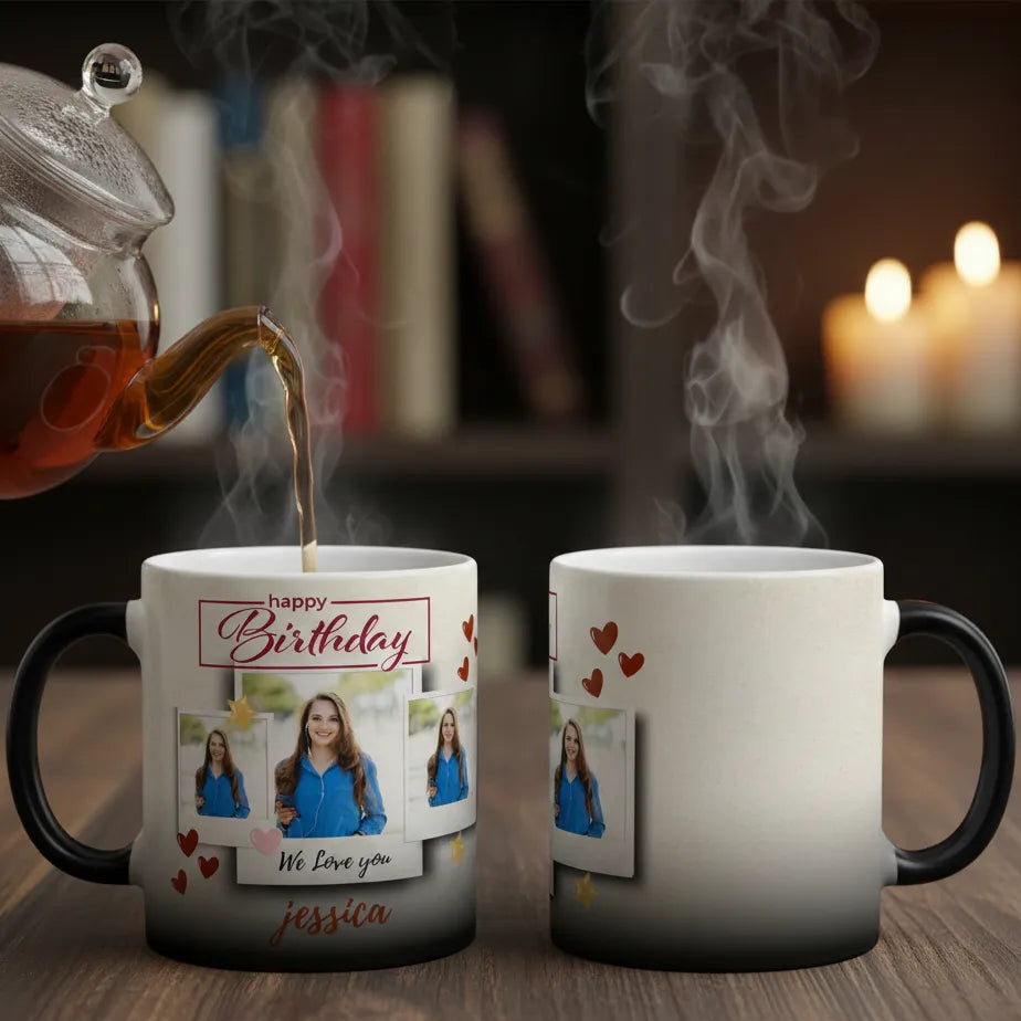 Two mugs with personalized designs, one being filled with steaming hot liquid, on a wooden surface.