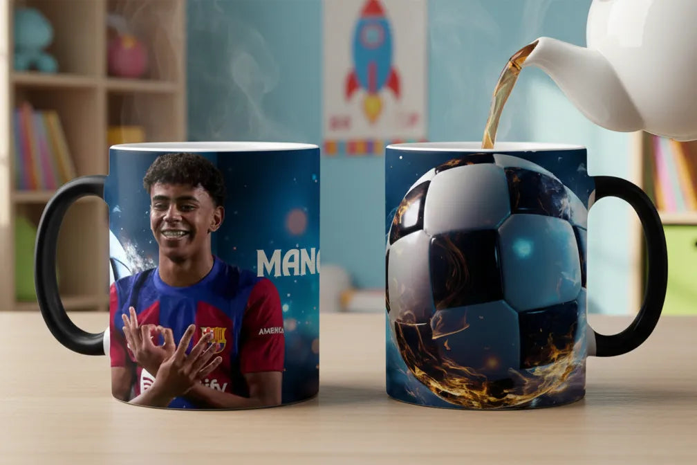 Two mugs, one with a soccer player and the other with a soccer ball design, on a table with a teapot pouring tea.