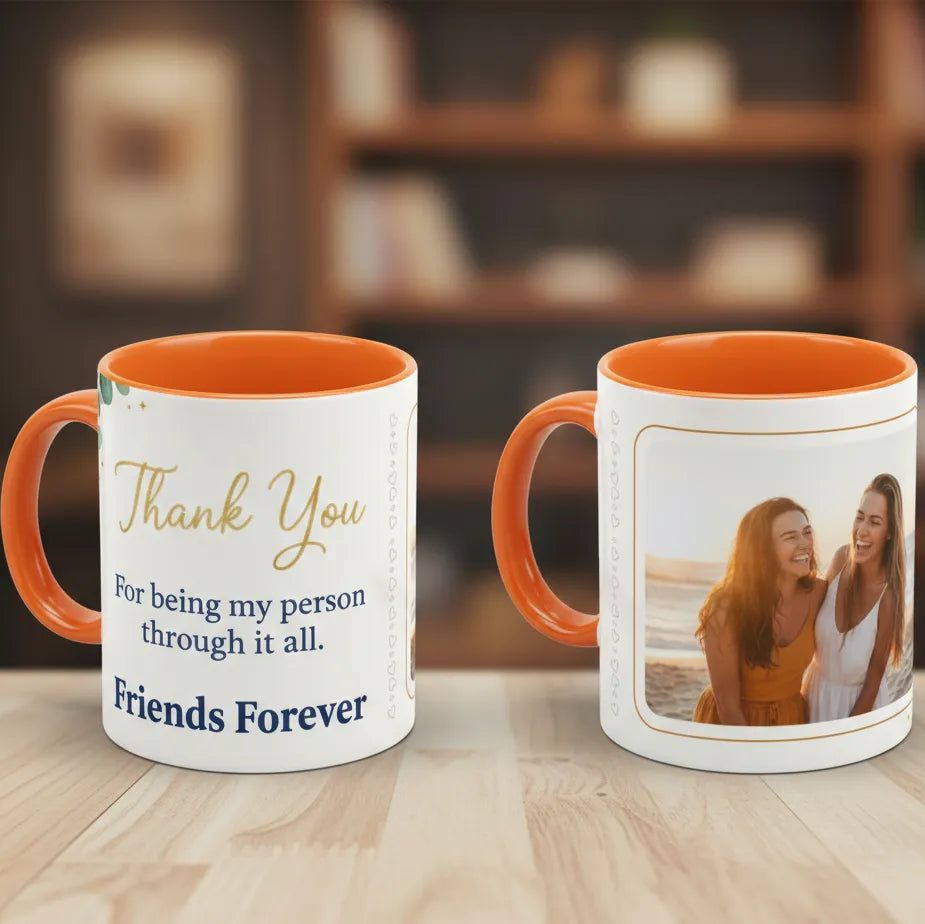 Two mugs with orange interior and handle, one with text and the other with a photo of two people.
