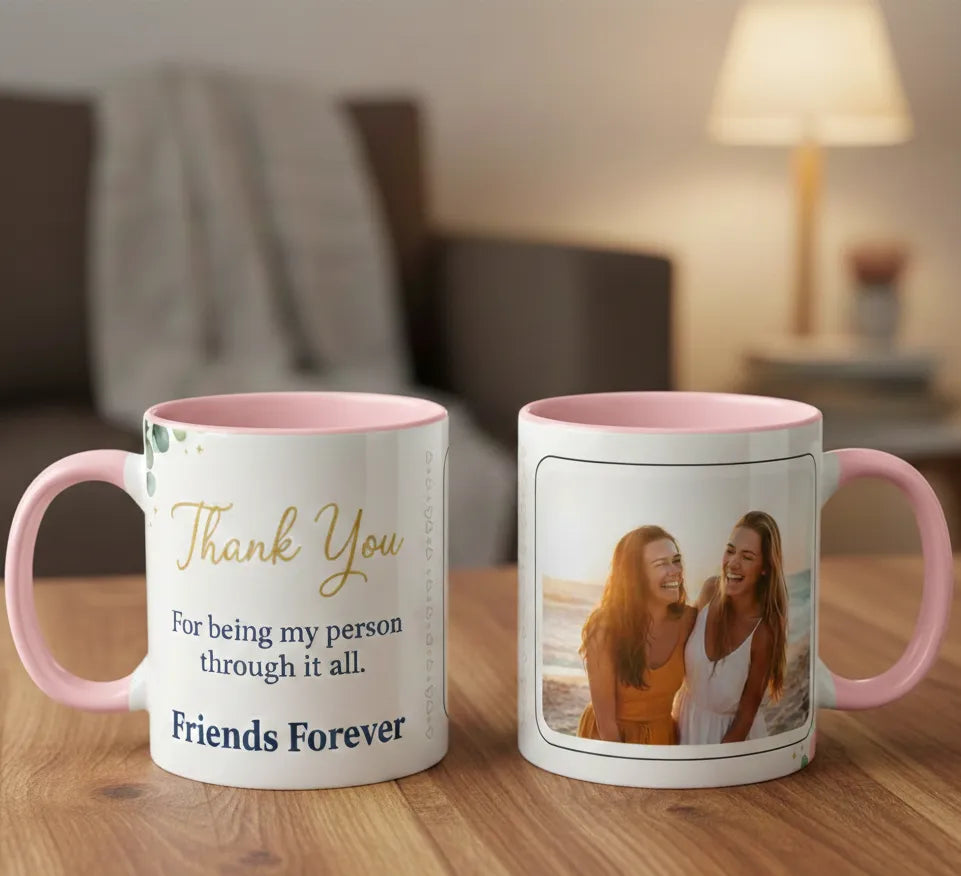 Two mugs on a wooden surface with one featuring text and the other with a photo of two people.