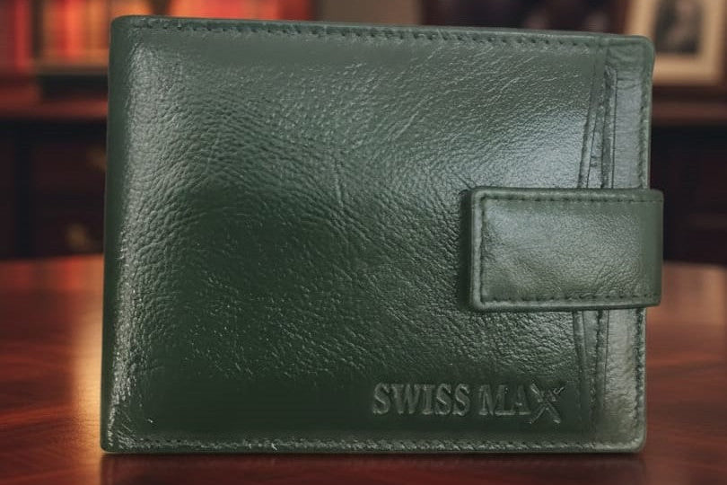 Green leather wallet with 'Swiss Max' branding on a wooden surface.